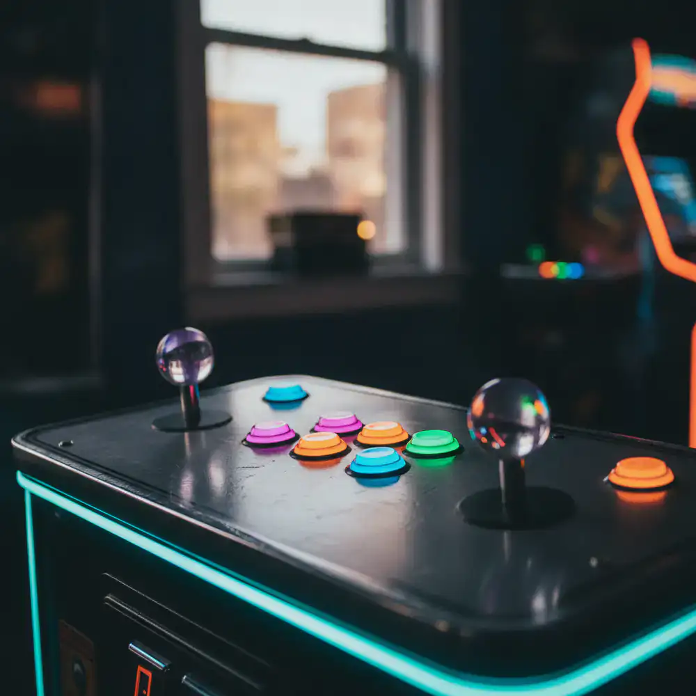 Close up of an illuminated retro arcade cabinet control panel